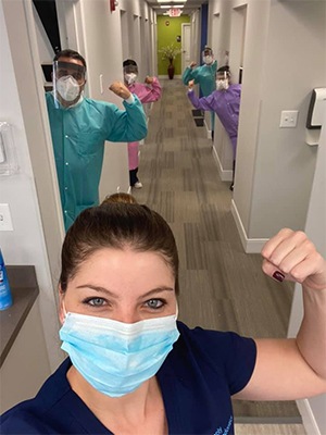 dental worker with mask taking a selfie