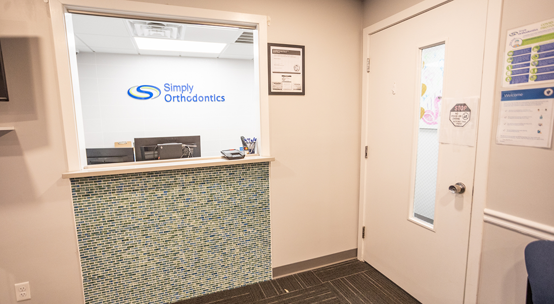 Reception desk and door leading to treatment area