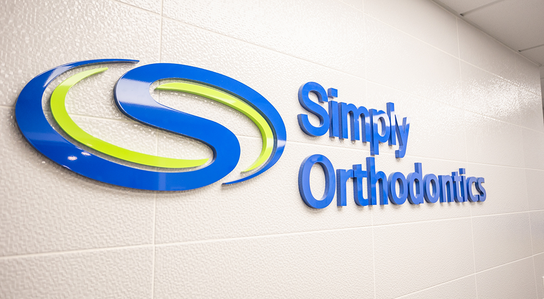 Simply Orthodontics sign on the wall