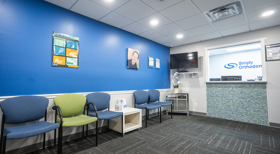 Blue and green chairs in the waiting area