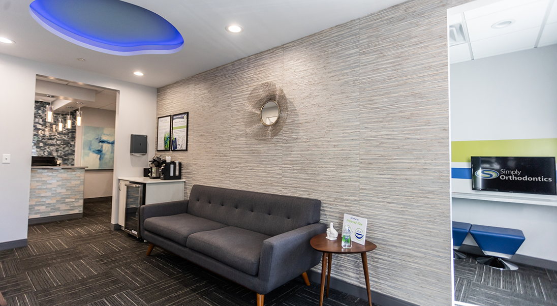 Black couch in the waiting area