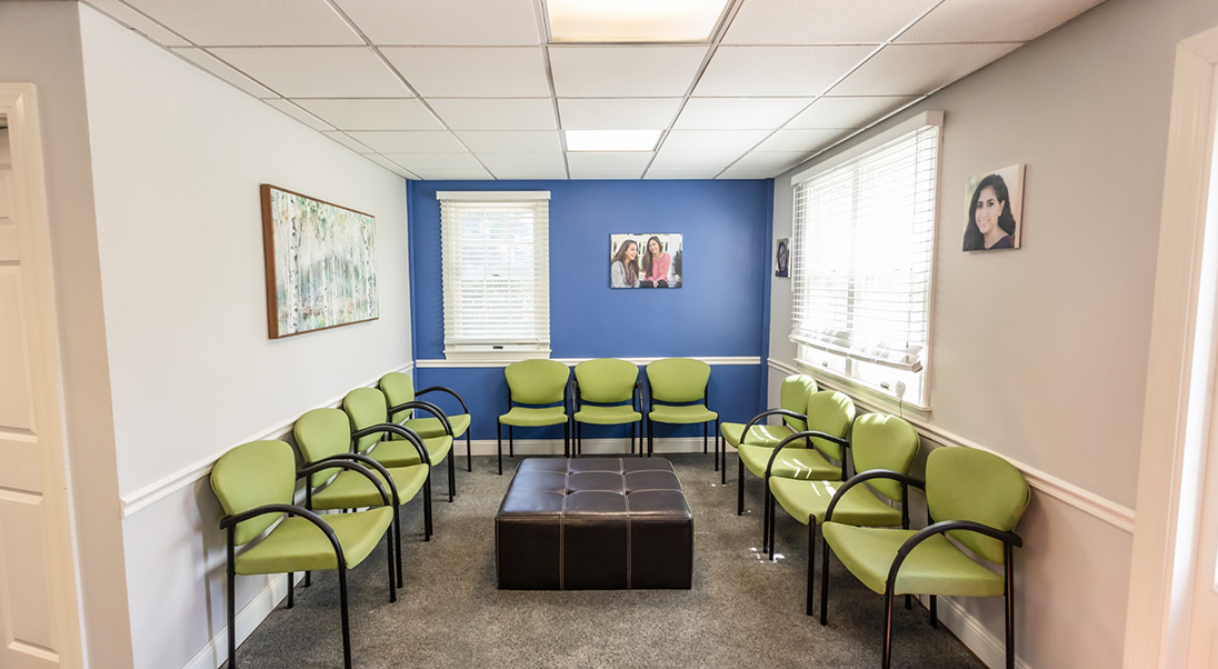 Green chairs in the waiting room