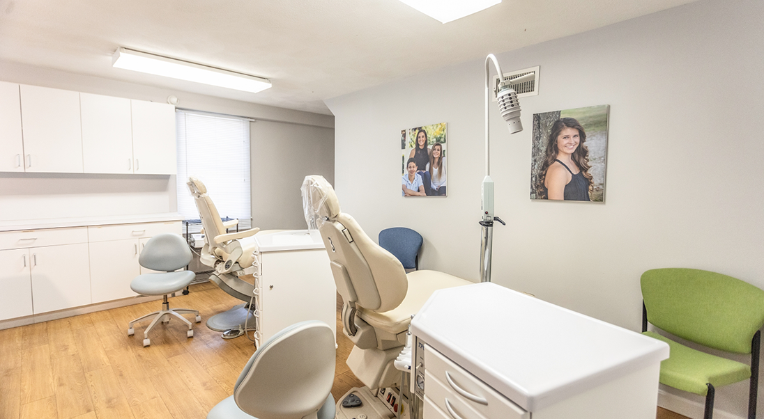 Two orthodontic treatment chairs next to each other