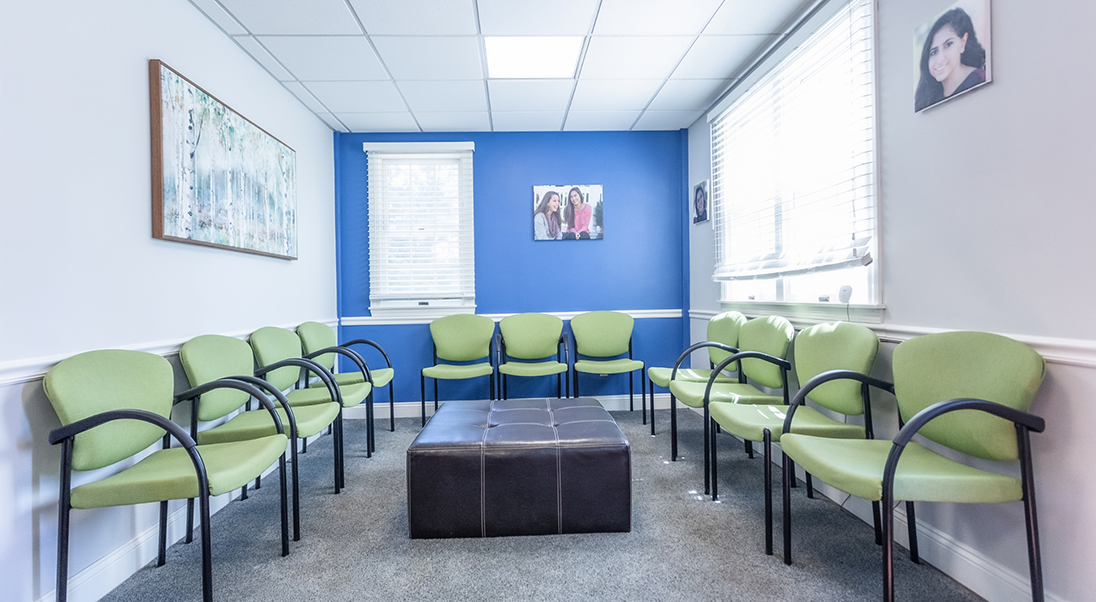 Green chairs in the waiting room