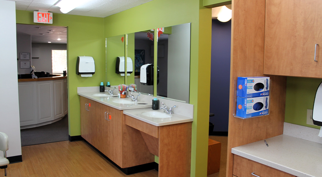 Three sinks and mirrors in a row
