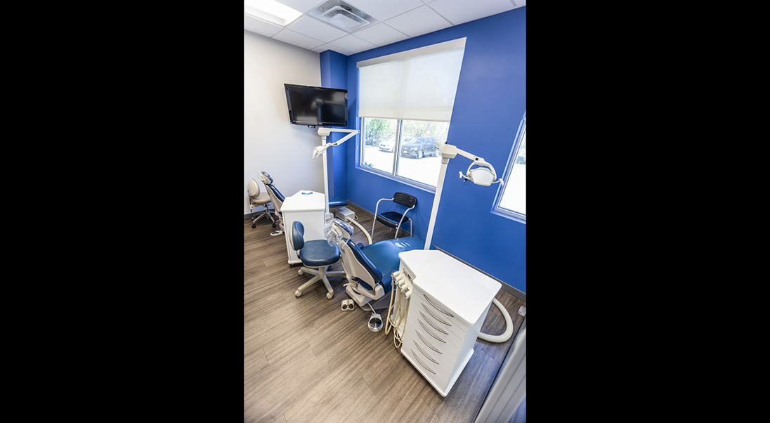 Two orthodontic treatment chairs next to each other