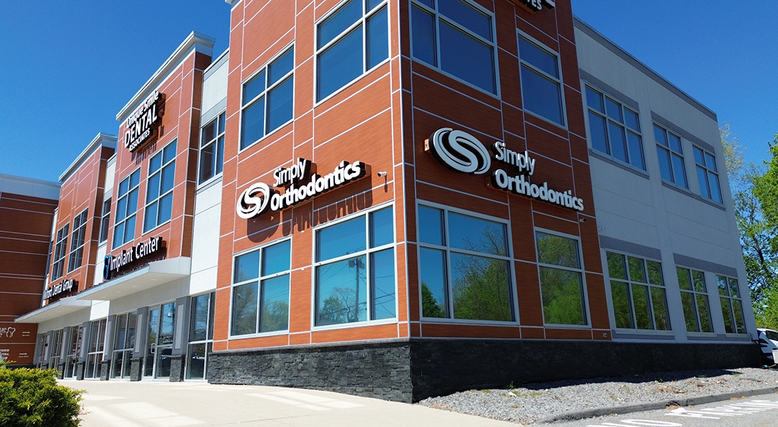 Exterior of the red and white Simply Orthodontics Milford office