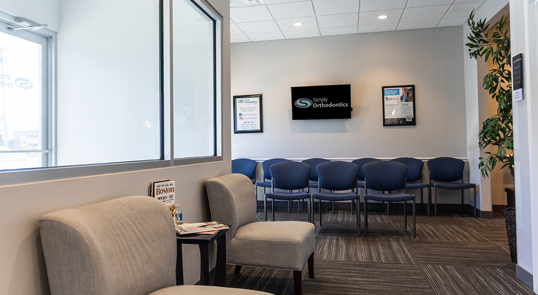 Blue and light brown chairs in the waiting area