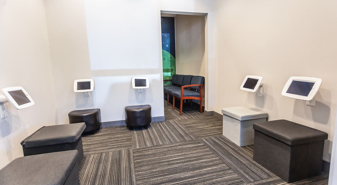 Several tablets attached to a wall