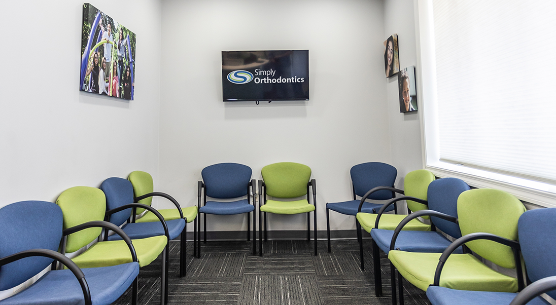 Close up of green and blue chairs in the waiting room