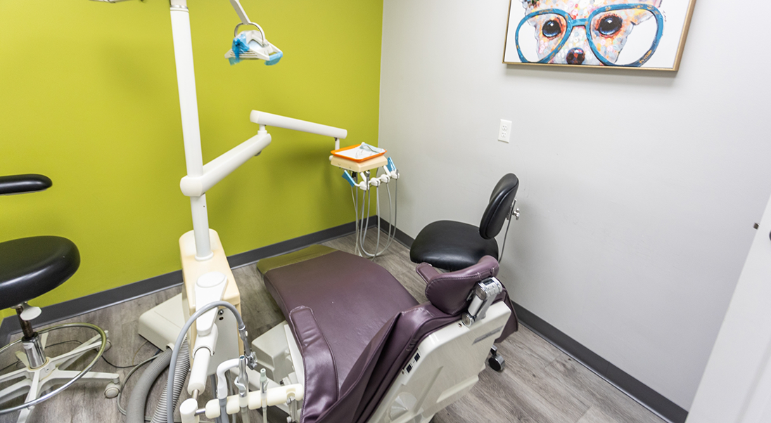 Treatment room with wall art of a dog wearing glasses