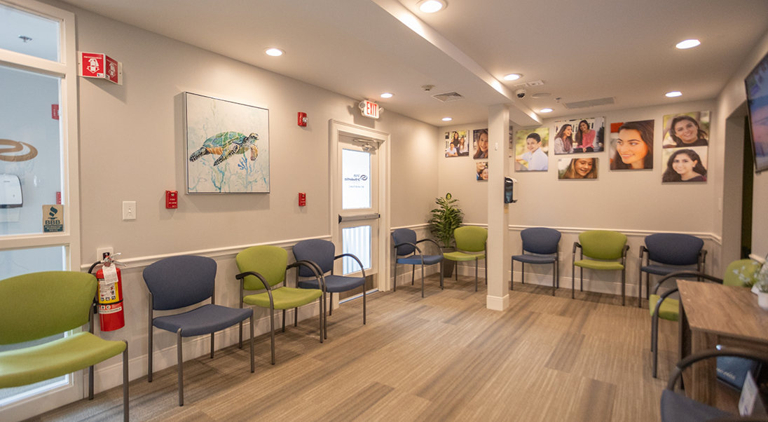 Green and blue chairs in the waiting area