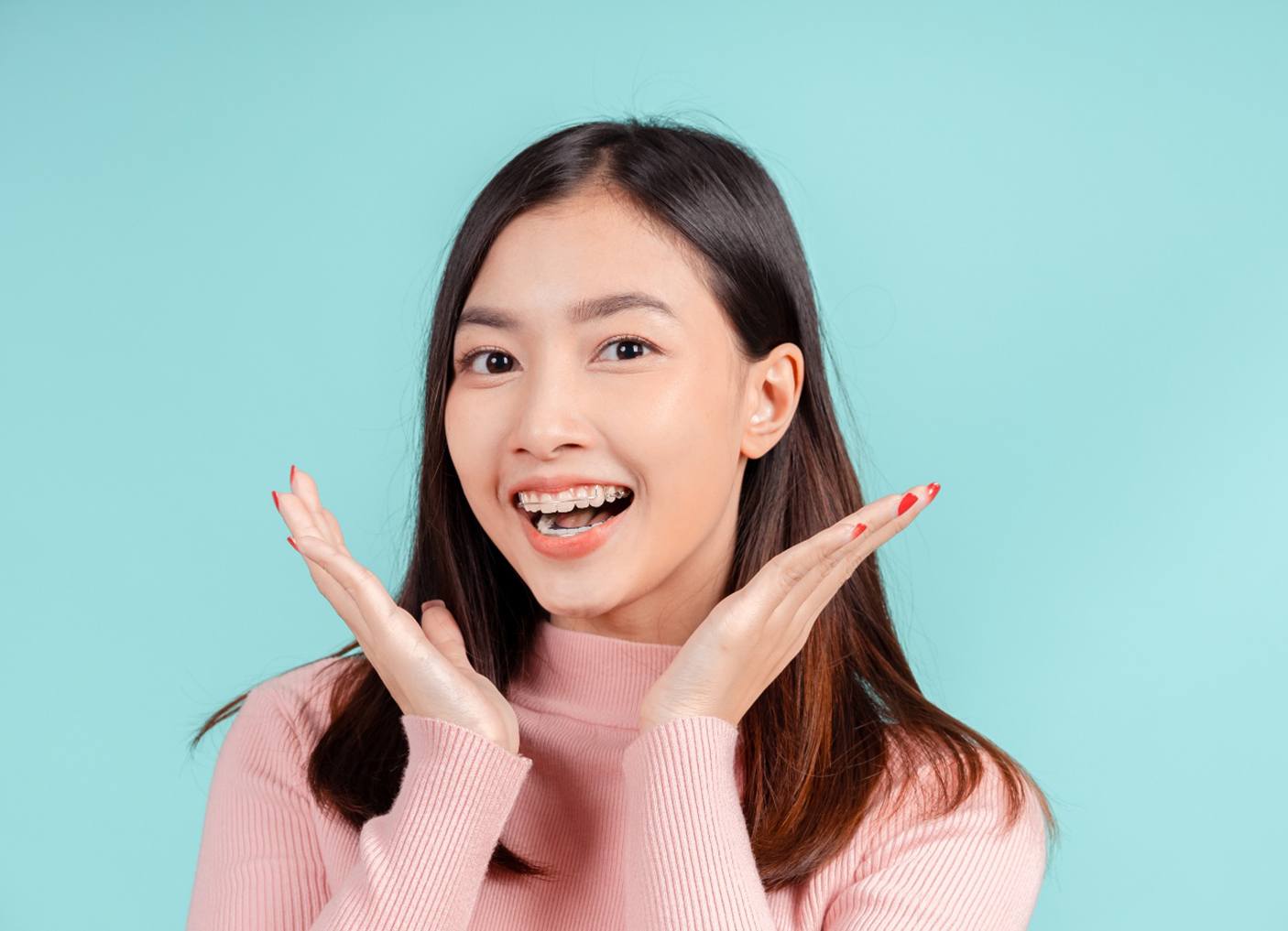 a patient with braces smiling