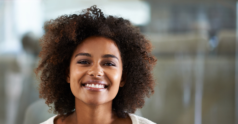 Smiling woman in a white blouse