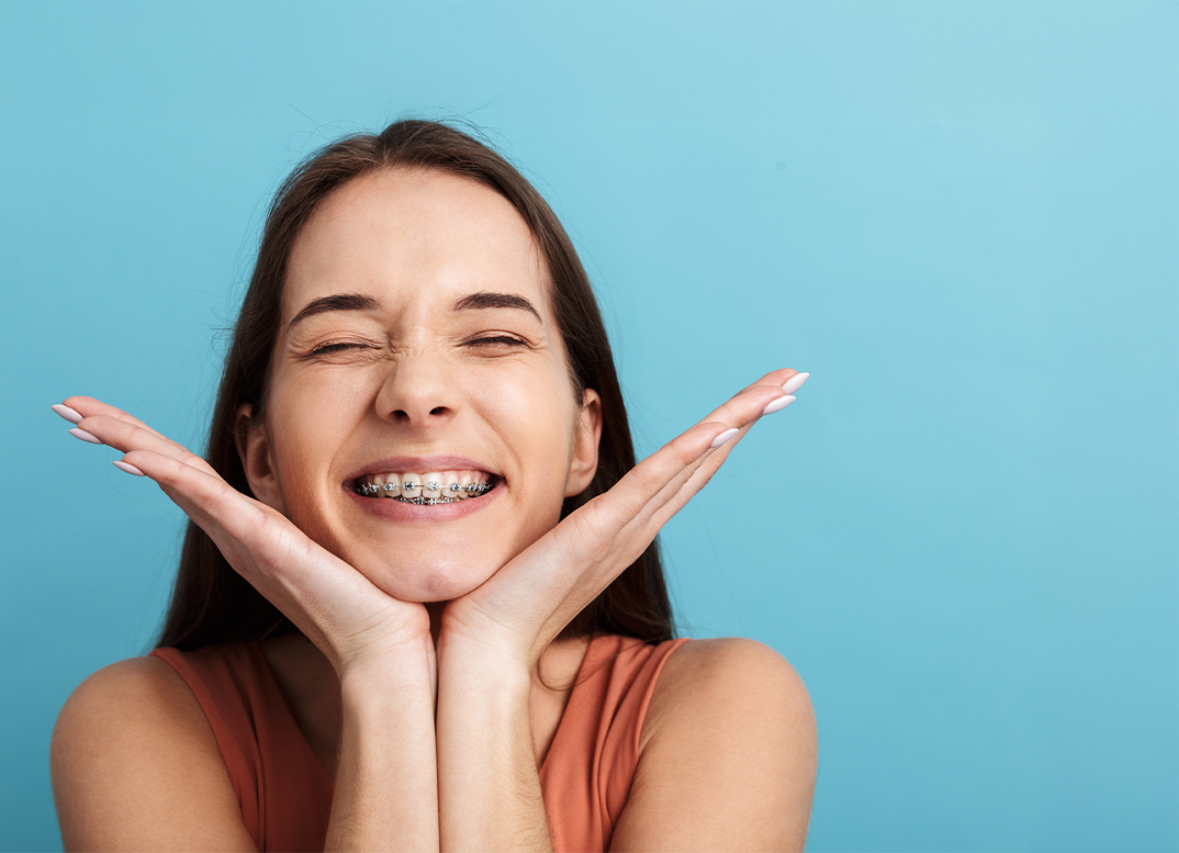 Young girl grinning with braces in Hopkinton