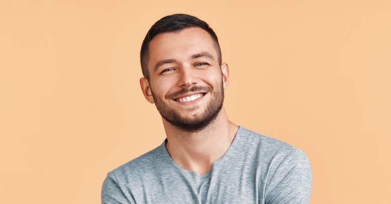 Smiling man in a gray shirt