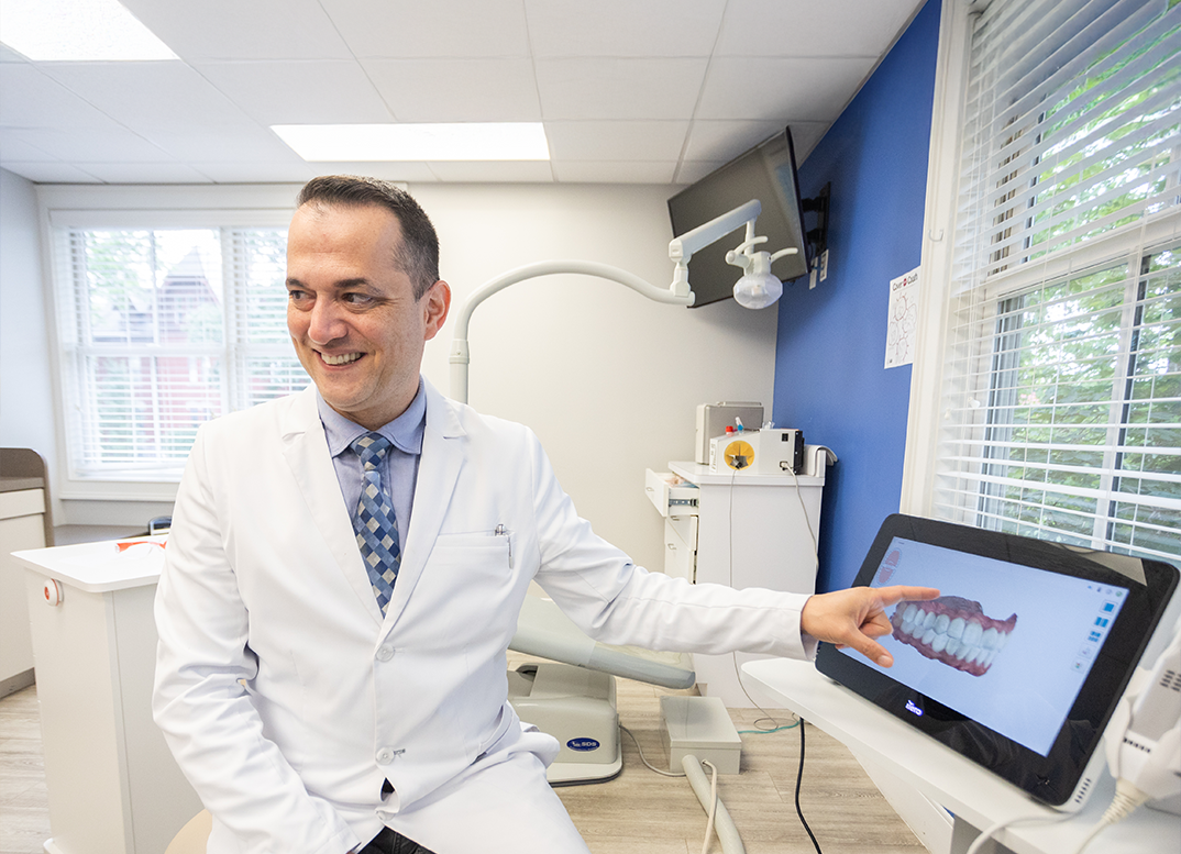 Worcester orthodontist smiling at a patient