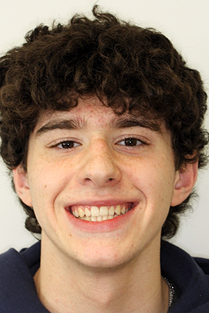 Smiling teenage boy with evenly aligned teeth