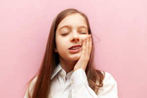 a patient with braces dealing with oral discomfort