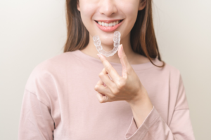 an Invisalign patient smiling confidently