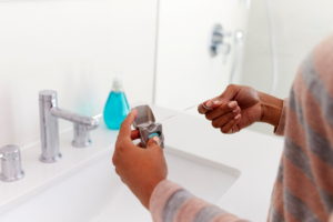 a person holding dental floss