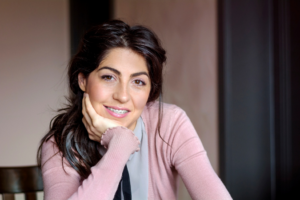 a patient with braces smiling confidently